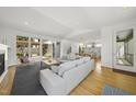 Open-concept living area with modern decor, natural light, and seamless flow to the backyard at 1101 Norris St, Raleigh, NC 27604