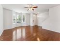 Bright living room with hardwood floors, bay window, and neutral paint at 2027 Hayes Ln, Holly Springs, NC 27540