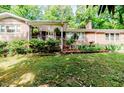 Traditional brick house with well-maintained landscaping and a cozy, inviting curb appeal at 2307 Piedmont Dr, Sanford, NC 27330