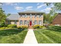 Charming brick home with gray shutters, manicured landscaping, and an inviting walkway at 2545 Churchill Dr, Burlington, NC 27215