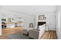 Bright and modern living room seamlessly connects to a renovated kitchen, great for entertaining at 2605 Joe Pruitt Rd, Oxford, NC 27565