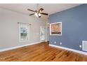 Inviting living room with hardwood floors, neutral walls, and an abundance of natural light at 305 Freeman St, Raleigh, NC 27601