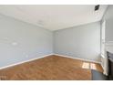 Bright living room boasts hardwood floors, fresh paint, modern fireplace, and large windows for natural light at 3604 Rivermist Dr, Raleigh, NC 27610
