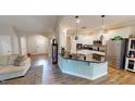 Well-lit kitchen featuring a large island, stainless steel appliances, and white cabinetry at 395 Carolina Landing Dr, Zebulon, NC 27597