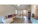 Open concept living room with modern design features, neutral colors, and abundant natural light at 395 Carolina Landing Dr, Zebulon, NC 27597