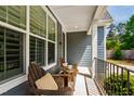 Cozy front porch featuring comfortable seating, perfect for relaxing and enjoying the neighborhood views at 4412 Powell Grove Ct, Raleigh, NC 27606