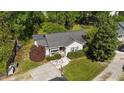 Aerial view of a single-story home showing the well-maintained lawn, driveway, and surrounding greenery at 508 2Nd Street St, Apex, NC 27502