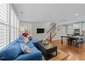 Open concept living room featuring wood floors, ample natural light, and access to the dining area at 511 N Person St # 101, Raleigh, NC 27604