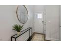 Inviting foyer featuring a white front door, a stylish mirror, console table, and modern decor at 714 Andrade Dr, Fuquay Varina, NC 27526