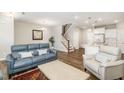 Open-concept living area flows into a modern kitchen with an island and breakfast bar at 717 Silo Park Dr, Wake Forest, NC 27587