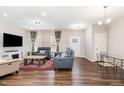 Spacious living room with hardwood floors, comfortable seating, and natural light at 717 Silo Park Dr, Wake Forest, NC 27587