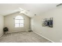 Bright bedroom featuring vaulted ceiling, neutral walls, plush carpet, and ample natural light at 732 Westview Ct, Nashville, NC 27856