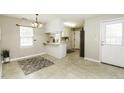 Eat-in kitchen with open design, tile floor, breakfast bar, and plenty of natural light at 732 Westview Ct, Nashville, NC 27856