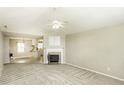Inviting living room boasts neutral decor, a cozy fireplace, and an open floor plan at 732 Westview Ct, Nashville, NC 27856