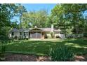 This home features a well-maintained lawn and a screened-in porch, perfect for enjoying the outdoors at 9 Kimberly Dr, Durham, NC 27707