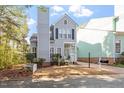 Charming two-story home with blue siding, black shutters, chimney, and well-manicured landscaping at 1601 Dunraven Dr, Raleigh, NC 27612