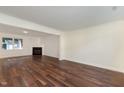 Spacious living room features hardwood floors, neutral walls, fireplace and lots of natural light at 2024 Spring Creek Dr, Durham, NC 27704