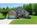 Beautiful brick home with lush green lawn and mature trees creating a serene and inviting atmosphere at 226 Marshview Cir, Angier, NC 27501