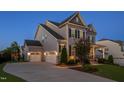 Beautiful two-story home featuring an attached two-car garage and long driveway at 3209 Star Gazing Ct, Wake Forest, NC 27587