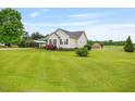 A lovely home with lush green lawn, carport, and blooming bushes at 40 Senter Farm Ct, Fuquay Varina, NC 27526