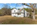 Exterior view of home from rear corner showing a screen porch at 4208 Louisbury Rd, Wake Forest, NC 27587