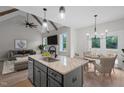 Well-appointed kitchen featuring an island, stainless appliances, and an adjoining dining area at 45 Leisure Ln # 4, Louisburg, NC 27549