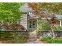 Stone clad home with a gated courtyard leading to the double door front entrance at 6600(A) Maynard Farm Rd, Chapel Hill, NC 27516