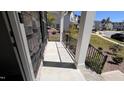 Inviting front porch with stone accents and black railings at 705 Blue Pointe Path, Apex, NC 27523