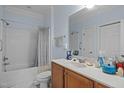 Cozy bathroom with tub and shower featuring vanity with sink and soft blue walls at 712 Portstewart Dr, Cary, NC 27519