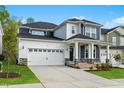 Charming two-story home with a manicured lawn and a two-car garage at 745 Aristocrat Ln, Knightdale, NC 27545