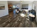 Spacious living room with modern decor, lots of seating and wood-look floors at 765 Whitley Rd, Middlesex, NC 27557