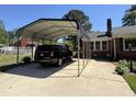 Attached carport providing covered parking and protection from the elements at 901 Vandora Ave, Garner, NC 27529