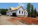 New home with brick foundation under construction and clear blue skies at 95 Autumnwood Ln, Spring Hope, NC 27882