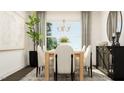 Inviting dining room with natural light, a modern chandelier, and elegant decor at 1012 Red Roses Ave, Durham, NC 27703
