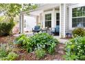 Inviting patio area with comfortable seating, perfect for outdoor relaxation and enjoying the garden at 111 Sir Richard Ln, Chapel Hill, NC 27517