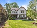 Traditional two-story home with well-kept lawn and landscaping at 1209 Kingston Ridge Rd, Cary, NC 27511