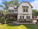 Beautiful two-story home with a well-manicured lawn and a cozy front porch, perfect for relaxing at 1209 Kingston Ridge Rd, Cary, NC 27511
