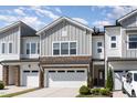 Beautiful townhome exterior with stone accents and attached garage at 132 Deardom Way, Chapel Hill, NC 27516