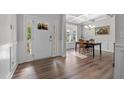 Welcoming foyer with beautiful wood floors, natural light, and an adjacent dining area at 1320 Abington Dr, Mebane, NC 27302