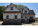 Two-story home with a mix of brick and siding, showcasing its architectural details at 1611 S Old Carriage Rd, Rocky Mount, NC 27804