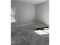 Unfinished bedroom with a large window offering natural light and a blank canvas for personal design at 200 Green Pines Estates Dr, Kenly, NC 27542