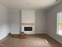 Cozy living room featuring an electric fireplace with shiplap accent wall, and a window providing natural light at 200 Green Pines Estates Dr, Kenly, NC 27542