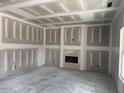 Living room showcasing drywall and a fireplace, ready for customization and personal touches at 200 Green Pines Estates Dr, Kenly, NC 27542