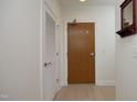 View of a hallway featuring closet and entry doors with hardware at 2402 Environ Way # Bldg 2000, Chapel Hill, NC 27517