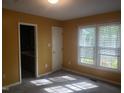 Cozy bedroom with bright natural light and an adjoining bathroom at 2416 Fields Of Broadlands Dr, Raleigh, NC 27604