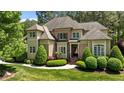 Beautiful home featuring manicured landscaping, brick accents and charming curb appeal at 255 Capellan St, Wake Forest, NC 27587