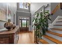 Grand foyer featuring soaring ceilings, chandelier, staircase, and hardwood floors at 255 Capellan St, Wake Forest, NC 27587