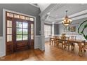 Inviting foyer with hardwood floors, dark wood door, and elegant trim details at 255 Capellan St, Wake Forest, NC 27587