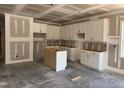 Kitchen featuring shaker style cabinets with an island and a window offering natural light at 329 Green Pines Estates Dr, Kenly, NC 27542