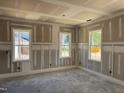 Room with three double hung windows with white trim and natural light with wainscoting under the windows at 329 Green Pines Estates Dr, Kenly, NC 27542